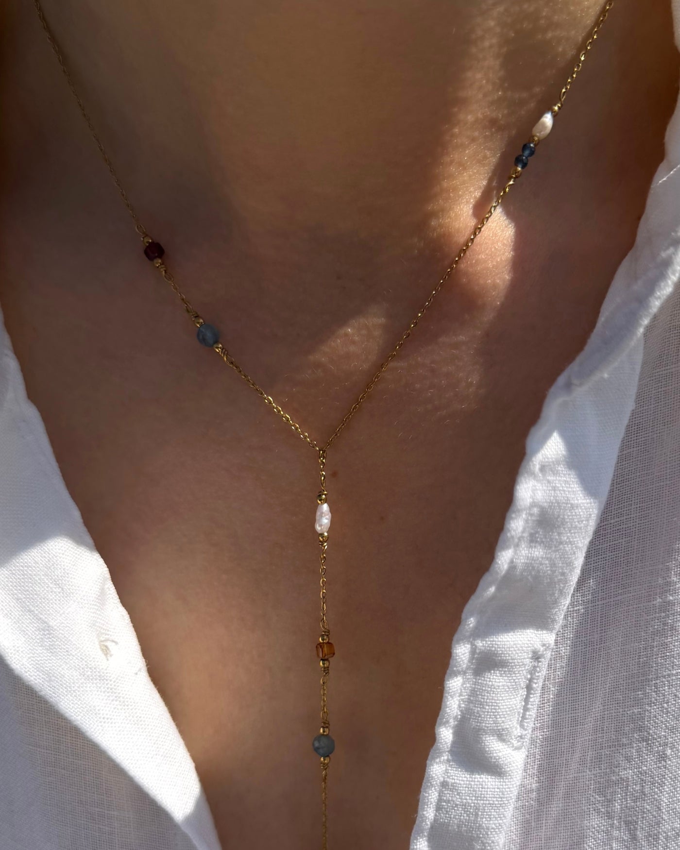 y ketting goud edelstenen parels